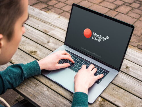 Man Typing on MacBook Pro Mockup