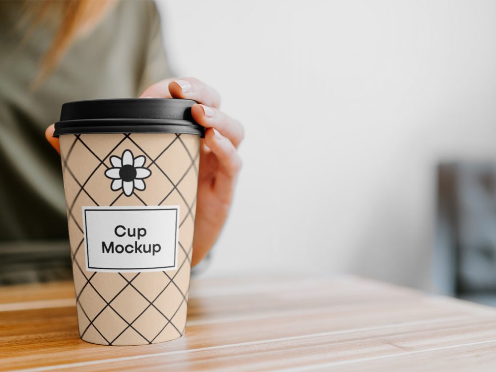 Coffee Cup with Hand Mockup