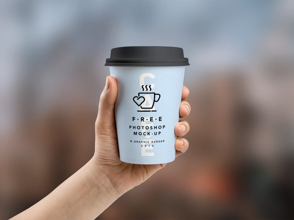 Coffee Cup in Hand Mockup