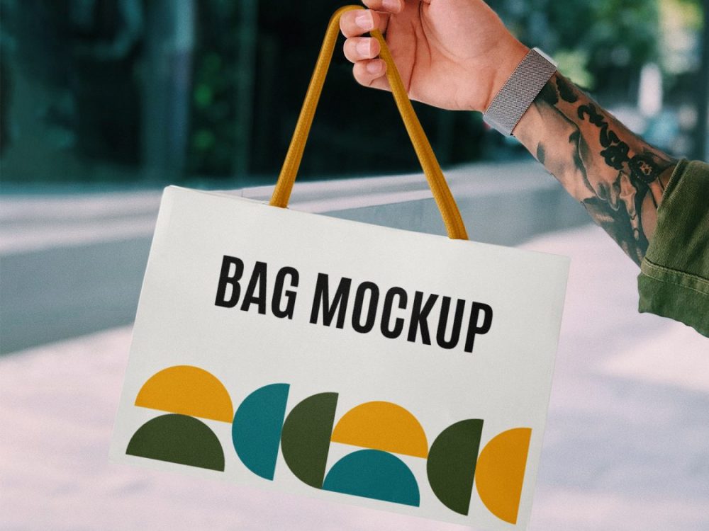 Hand Holding Mini Shopping Bag Mockup