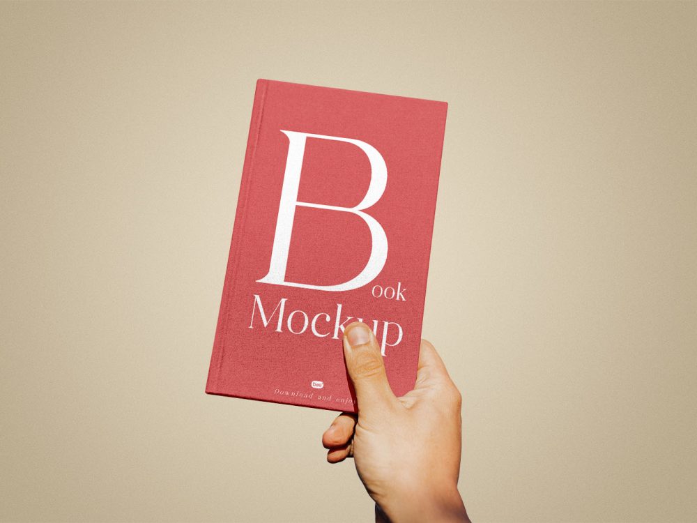 Book Cover in Hand Free Mockup