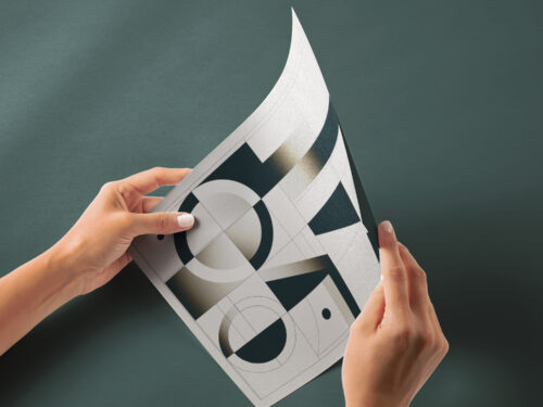 Hand Holding Glossy Paper Free Mockup