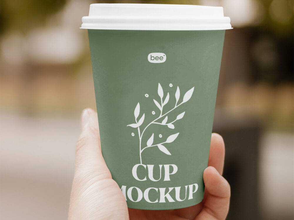 Paper Cup in Hand Free Mockup